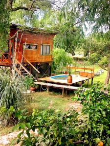 a small house with a swimming pool next to it at Krasia May in Tigre