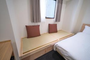 Postel nebo postele na pokoji v ubytování Ano Hotel Asakusa