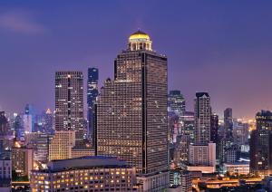 a tall building with a dome on top of it at Tower Club at lebua in Bangkok