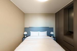 Postel nebo postele na pokoji v ubytování Hotel The Blue Terra