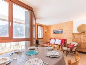 a dining room with a table with plates on it at Spacieux appartement à Serre-Chevalier pour 6 pers. avec terrasse, parking couvert et wifi - FR-1-330E-74 in Le Villard-Late