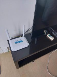 a computer monitor sitting on top of a desk at Simple Studio Unit N Centrio Tower in Cagayan de Oro
