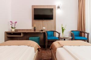 Ένα ή περισσότερα κρεβάτια σε δωμάτιο στο Hotel Orizont