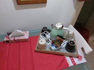 a tray with a tea pot on a table at Casa Nave in Monopoli