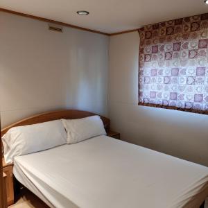 A bed or beds in a room at Camping Susen