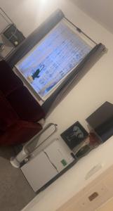 a desk with a laptop on top of a table at Spacious Double Room in prime location London in London