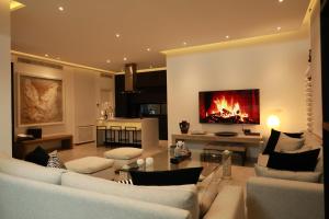 a living room with a couch and a fireplace at La brise de Carthage: Earthly paradise in Carthage