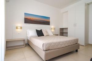 Кровать или кровати в номере Hotel Jonio