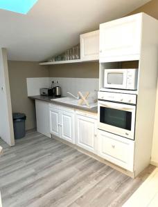 Kuchnia lub aneks kuchenny w obiekcie Cosy Camon Bolt-Hole