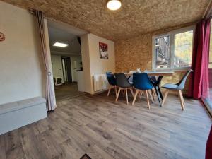 a room with a table and chairs and a window at Boost Your Immo Vars Ô Chalet Dana 801 in Vars