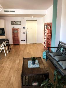 a living room with a couch and a table at Casa Rita in Brescia