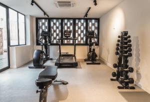 a gym with several exercise equipment in a room at tent Capi Playa in Playa de Palma