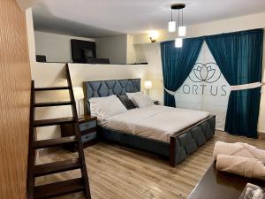 a bedroom with a bunk bed and a ladder at Ortus - Murree Hills in Murree