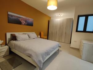 Ein Bett oder Betten in einem Zimmer der Unterkunft Deep Blue