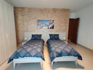 Ein Bett oder Betten in einem Zimmer der Unterkunft Deep Blue
