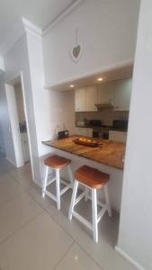 Η κουζίνα ή μικρή κουζίνα στο Dolphin Africa Apartment +15 φωτογραφίες