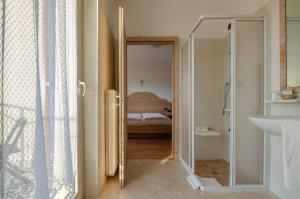 A bed or beds in a room at Agritur Cristina