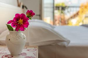 A bed or beds in a room at Agritur Cristina