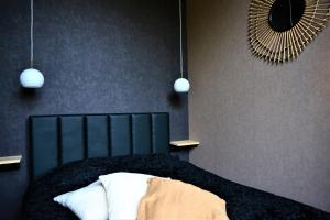 a bedroom with a bed with a mirror on the wall at SLEEP INN - Junior Suite 1 Private terrace in Antwerp