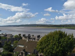 a view of a town and a river with houses at Teds Place in Arnside