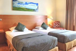 Postel nebo postele na pokoji v ubytování Lux Tychi Hotel