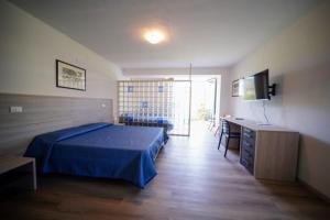 Voodi või voodid majutusasutuse Hotel Capo Di Stella toas