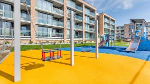 Detský kútik v ubytovaní Apartament Grey 10 C Perłowa Przystań - Holiday City