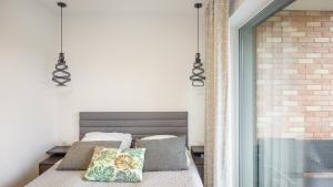 Posteľ alebo postele v izbe v ubytovaní Apartament Grey 10 C Perłowa Przystań - Holiday City