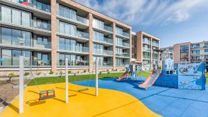 Detský kútik v ubytovaní Apartament Grey 10 C Perłowa Przystań - Holiday City