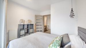 Posteľ alebo postele v izbe v ubytovaní Apartament Grey 10 C Perłowa Przystań - Holiday City