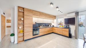 Kuchyňa alebo kuchynka v ubytovaní Apartament Grey 10 C Perłowa Przystań - Holiday City