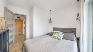 Posteľ alebo postele v izbe v ubytovaní Apartament Grey 10 C Perłowa Przystań - Holiday City
