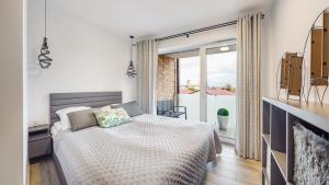 Posteľ alebo postele v izbe v ubytovaní Apartament Grey 10 C Perłowa Przystań - Holiday City