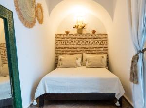 a bedroom with a bed in a room at RIAD MAJWRIL in Marrakesh