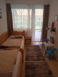 Postel nebo postele na pokoji v ubytování Csiribá Apartman + 12 fotografií
