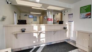 a waiting room with a counter in a hospital at Motel 6-Owensboro, KY in Owensboro +39 photos