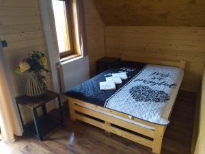 En eller flere senge i et værelse på Siedlisko na Jastrząbce