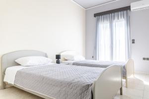 Posteľ alebo postele v izbe v ubytovaní Villa Archodia - With Private Pool