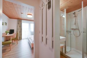 a bathroom with a shower and a sink at Landhaus Grobert in Seeg +99 photos