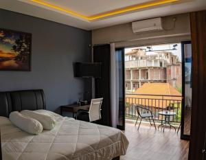 Postel nebo postele na pokoji v ubytování Berawa Homestay