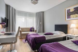 Un pat sau paturi într-o cameră la Best Western Hotel Varnamo