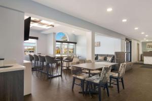 a dining room with a table and chairs at MainStay Suites Clarion, PA near I-80 in Clarion