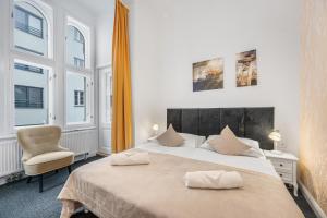 Postel nebo postele na pokoji v ubytování Downtown Bratislava B&B