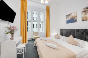 Postel nebo postele na pokoji v ubytování Downtown Bratislava B&B