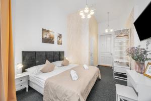 A bed or beds in a room at Downtown Bratislava B&B