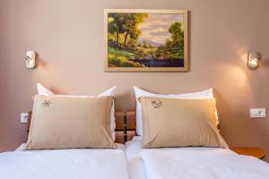 En eller flere senge i et værelse på Apartman Ana