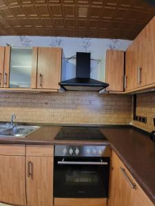 a kitchen with a sink and a stove top oven at Monteur Wohnung in Melle