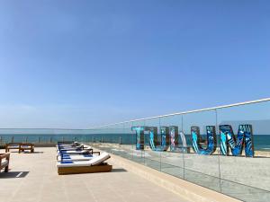 a row of chaise lounges on the beach at Tulum Beach Resort Dakhla in Dakhla