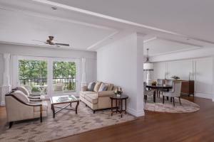 a living room with a couch and a table at InterContinental Bali Resort by IHG in Jimbaran