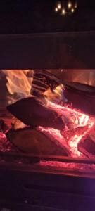 a group of meat being cooked in an oven at Hotel Tutto in Galičnik